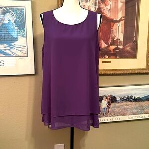 NWT top layered as seen in picture and is lined
